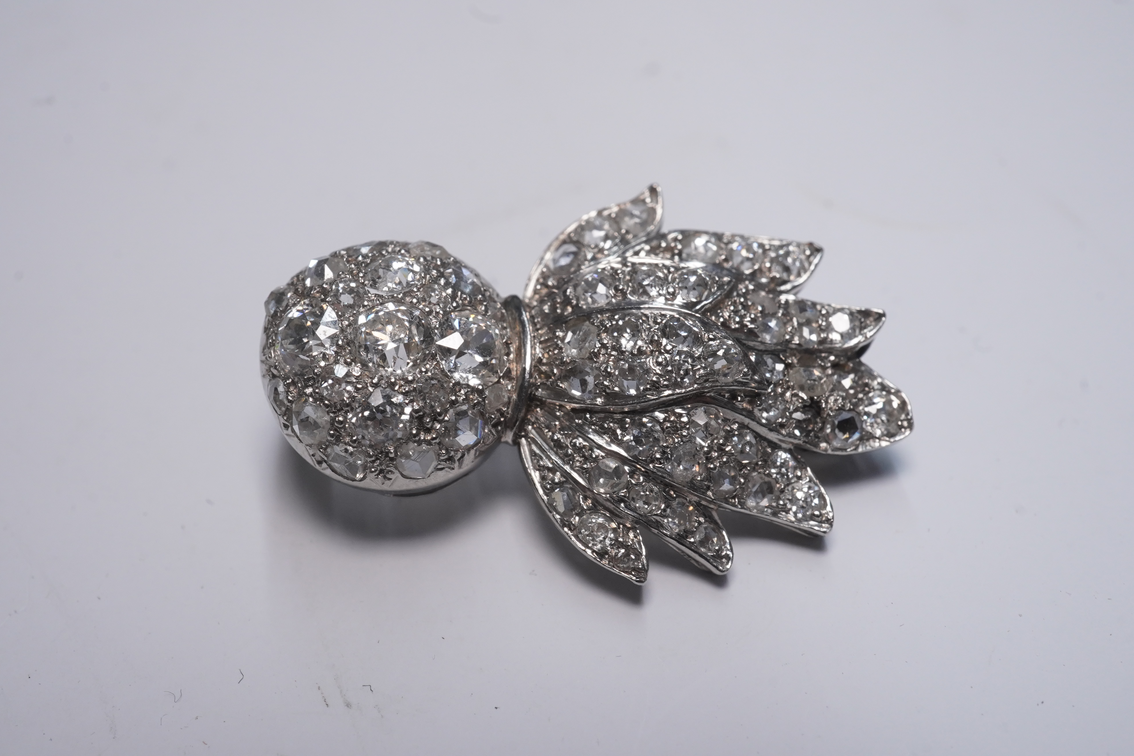 A mid 20th century white gold and pave set diamond Royal Fusiliers sweetheart brooch